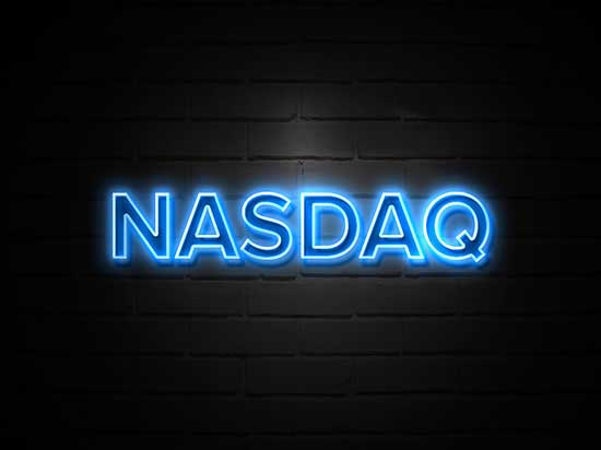 Neon NASDAQ sign on wall